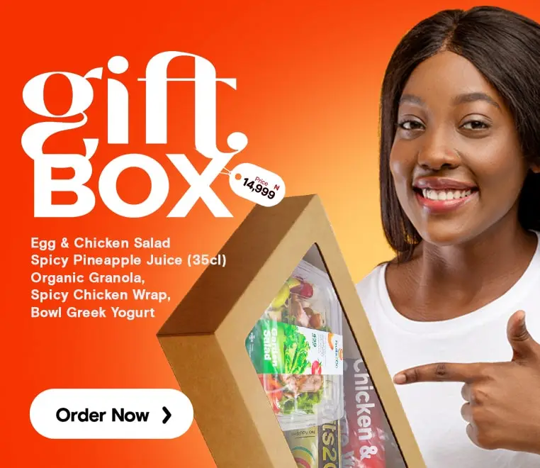 a woman pointing at a box of food